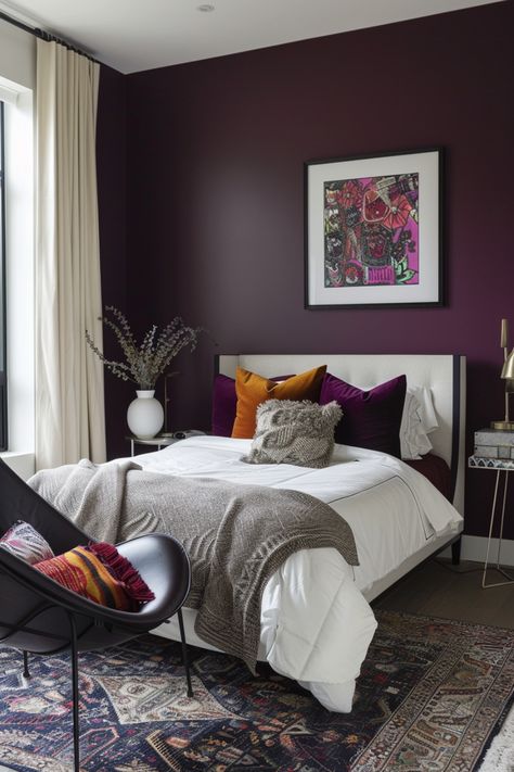 Discover 14 minimalist, colorful boho bedroom decor ideas. Transform your space with vibrant accents, simple designs, layered textiles, and natural elements. Embrace a blend of minimalism and boho charm for a cozy, stylish retreat that reflects your unique taste. Neutral Bedroom With Purple Accents, Plum Purple Room, Deep Purple Room Ideas, Plum And White Bedroom, Plum Master Bedrooms Decor, Purple Headboard Bedroom Ideas, Small Girly Bedroom Ideas, Purple Paint Room, Eggplant Bedroom Walls