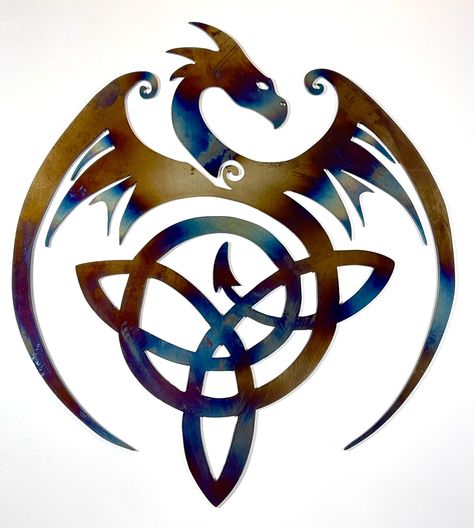 CNC Plasma cut metal wall art: Gorgeous flying dragon with Celtic knot in tail. Cut from 14 gauge mild steel, heat treated to color, with powder coat finish. Measures 14x12 inches. Color may vary due to heat treating process. Great decoration for living room, den, garage, bedroom, or any space. Makes for a unique and stunning gift. Celtic Dragon Drawing, Dragon Celtic, Celtic Dragon Tattoos, Dragon Silhouette, Alchemy Art, Dragon Tattoo For Women, Garage Bedroom, Flying Dragon, Celtic Dragon