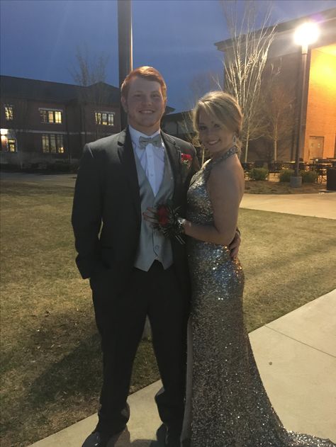 Silver Prom Dress Couple, Silver And Black Prom Couple, Silver Prom Couple Outfit, Black Tux With Silver Vest And Tie, Silver Prom Couple, Silver Prom Dress With Date, Silver Prom Suits, Silver Tux, Tux Prom