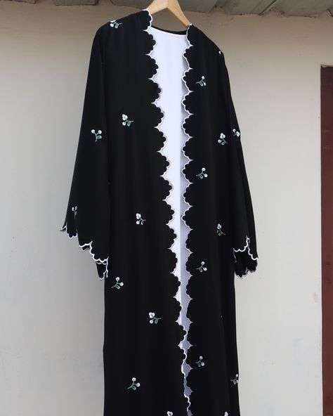 Elevate your modest wardrobe with this elegant black shrug-style abaya, adorned with delicate white cutwork embroidery on the edges and floral embroidery on back,front and sleeves…Paired with a plain white inner and matching plain white stole, this abaya effortlessly combines grace and sophistication for any occasion. . . DM for order . . Customisation available . . . #abaya #abayafashion #abayacollection #abayalovers #abayablack #shrugabaya #modestwear #modesty #modestyisgorgeous #modeststyle Shrug Outfit, Shrug Style, White Stole, Abaya Fashion Dubai, Abaya Black, Modest Wardrobe, Black Shrug, Simple Hijab, Cutwork Embroidery