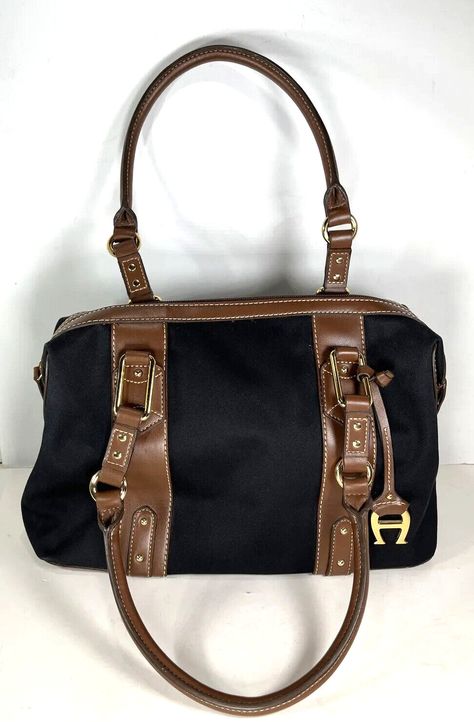 This is for an ETIENNE AIGNER Saville Collection Black Cotton with Brown Faux Leather Trim Satchel Shoulder Bag! Condition: NWT, never used, but might have a few tiny areas of dustiness from storage. Features: Please look closely at the pictures as they are part of the description.  Feel free to ask for any further questions in regard to the details! B1300/928 Etienne Aigner, Leather Trim, Leather Trims, Black Cotton, Bags Handbags, Satchel, Shoe Accessories, Faux Leather, Bag Lady