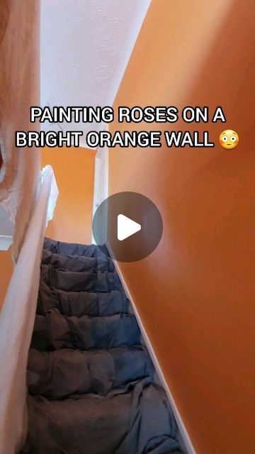 SpraySaint on Instagram: "Painting Roses on an orange wall in a stairwell.

.
.
.

#spraysaint #homedecor #roses #artist #painting #spraypainting #spraypaintart #streetartist #graffiti #handpainted #wallart #wallmural #muralartist #murals #muralpainter #paint" Rose Mural Wall, How To Paint Stairwell, Stairwell Mural, Spray Paint Wall, Painting Roses, Instagram Painting, Wall Murals Painted, Spray Paint Art, Orange Walls