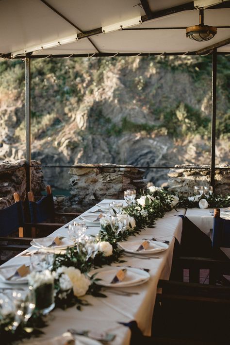 Elegant white and green reception decor | Image by Serena Cevenini Photography Cinque Terre Italy Wedding, Churches In Italy, Elopement Dinner, Cinque Terre Wedding, Green Reception, Italian Seaside, Bridal March, Wedding Features, Gown Photography