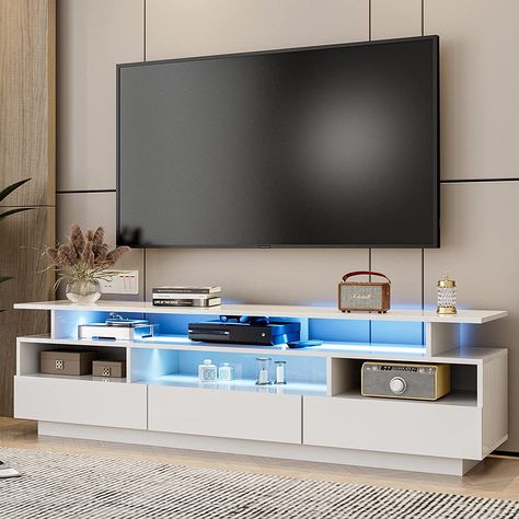 This LED entertainment center is perfect to support 65" TVs in plasma, LED, OLED, and LCD options, which means the TV & media furniture game console cabinet is designed for your home decor/office/bedroom/living room. 65 Inch Tv Living Room, 65 Inch Tv Stand, Game Room Bedroom, 65 Inch Tv, Under Tv, Led Tv Stand, Modern Entertainment Center, White Tv, Cabinets White