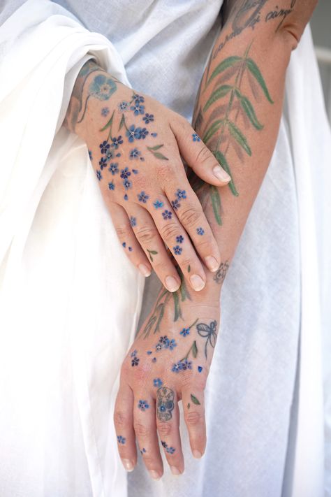 Hands flower tattoo by mirunatattooist Wild Flower Hand Tattoo, Forget Me Nots Tattoo, Flower Hand Tattoos, Floral Hand Tattoo, Forget Me Not Flower Tattoo, Forget Me Nots Flowers, Spilled Ink, Inner Forearm Tattoo, Bottle Tattoo