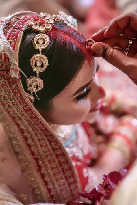 Did you know that sindoor is a mark of love, trust, respect and marriage? Here's an exciting insight into the rituals of Indian Wedding. #indianwedding #indianbride #indianweddingphotography #indianbride #sindoor #sindoorinhair #sindoor #traditions #weddingphotography #weddingphotographer #style #styleinspiration #styleicon Hindu Wedding Rituals, Indian Wedding Rituals, Hindu Wedding Photos, Indian Wedding Photography Ideas, Middle Class Family, Indian Wedding Aesthetic, Marriage Poses, Indian Bride Photography Poses, Indian Wedding Poses