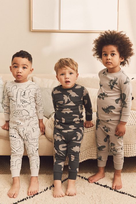 This adorable 3-pack of snuggle pyjamas is available in a selection of cute character designs, boasting a comfortable pure cotton construction with elasticated waist bottoms and ribbed cuffs. Machine washable. 3 x Pyjama Top and 3 x Pyjama Bottom 100% Cotton. Brown Dinosaur, Black Dinosaur, Boys Christmas Pajamas, Boys Pjs, Boys Nightwear, Kids Nightwear, Kids Pjs, Night Suit, Boys Pajamas