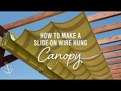 Add extra shade and style to your outdoor living space with a retractable wire-hung canopy system. Our DIY video will walk you through every step. Diy Retractable Pergola Canopy, Diy Shade Canopy, Pergola Canopy Diy, Slide Wire Canopy, Patio Shade Covers, Cowboy Cottage, Retractable Shade, Backyard Shade, Retractable Pergola