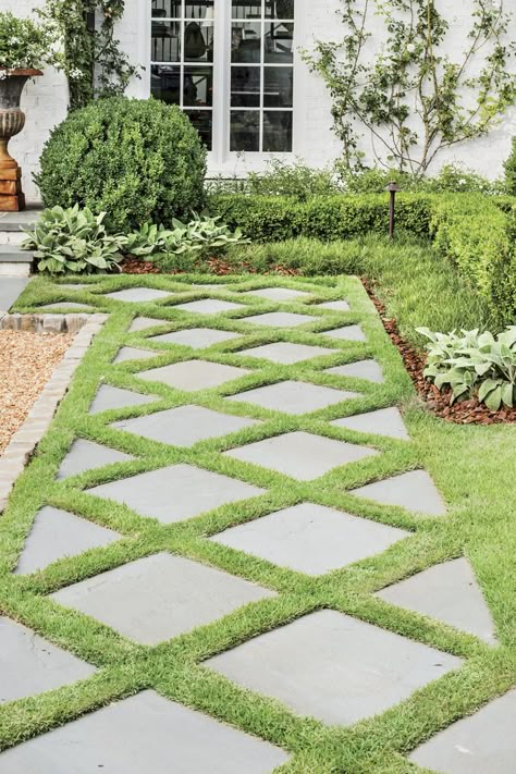 How do you catch the eyes of passersby? Design a welcoming path. Dorlon pulled inspiration for this diamond-patterned one from an existing exterior feature. #landscaping #gardening #southernliving Stone Grass Walkway, Walk Path Landscape, Stones In Grass Walkway, Stepping Stones With Grass In Between, Grass Stone Walkway, Grass Design Pattern, Unique Walkways To Front Door, Turf And Pavers Front Yard, Stone And Grass Driveway