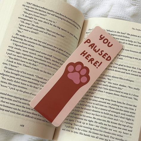 Happy #nationalbookloversday ! I’m so happy that I’m releasing my bookmarks on this day!!! Here’s one of my themes , I also have this available in doggy paws as well! These are completely handmade , hand drawn , and made with love! They’re laminated for extra protection as well 🩷 Share this with someone who loves cats!!! . . . #bookmarkshop #bookmarkart #catloverclub #bookishgirl #bookishart #bookloversofinstagram #bookstagram Bookmark Cat Design, Hand Drawn Bookmarks, Bookmarks Diy, Handmade Bookmarks Diy, Bookmarks For Books, Cute Easy Doodles, Handmade Bookmarks, Creative Bookmarks, Easy Doodles