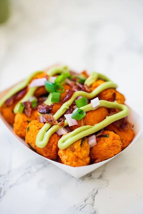 Potato Tater Tots, Food Truck Ideas, Sweet Potato Tater Tots, Healthy Junk Food, Vegan Food Truck, Paleo Snack, Food Truck Menu, Avocado Crema, Loaded Sweet Potato