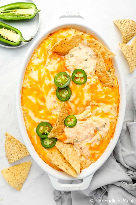 Holy jalapeño, have we got a dip for you! This crowd-pleasing jalapeño cheese dip is super cheesy and creamy with just the right touch of spice. It's almost like a jalapeño popper in dip form! Enjoy it at gatherings, BBQs, or potlucks. Everyone will love the way the strings of cheese stretch out when they pull away their dipped bread, veggies, crackers, or chips - it's the magical moment when flavor meets fun! #theendlessmeal #cheesedip #lowcarb #glutenfree #appetizer #hotcheesedip #hotdip #jala Cheesy Jalapeno Dip, Hot Cheese Dip Recipes, Jalapeno Cheese Dip, Cheese Jalapeno Dip, Best Party Dips, Glutenfree Appetizer, Velveeta Cheese Dip, Cheddar Dip, Jalapeno Dip