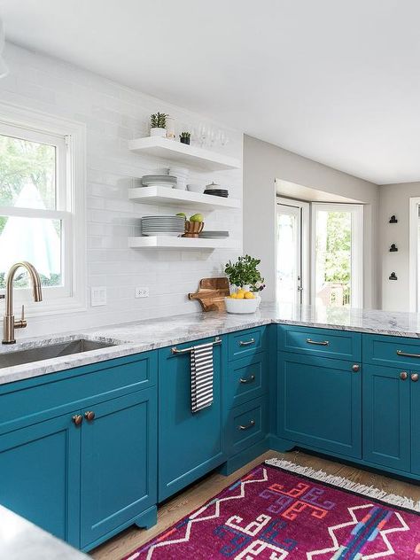 Peacock blue cabinets in a contemporary kitchen with brass pulls and white subway tiles. Light Fixture Ideas, Peninsula Kitchen Design, Blue Cabinetry, Blue Kitchen Island, Galley Style Kitchen, Kitchen Finishes, Blue Kitchen Cabinets, Let There Be Light, White Subway Tiles