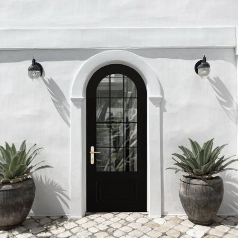 Ever wonder why arch doors always catch your eye? 👀 It’s because they instantly add character and charm, creating an entryway that feels both welcoming and unique.

Whether you're going for modern elegance or something with a Mediterranean twist, an arch door makes sure your entrance is anything but ordinary.

Would you add one to your home? 

#interiordesign #mediterraneanhome #designerhardware Arch Doors, Designer Doors, Arched Front Door, Creating An Entryway, Arch Door, Black Arch, Arched Doors, Mediterranean Home, Door Ideas