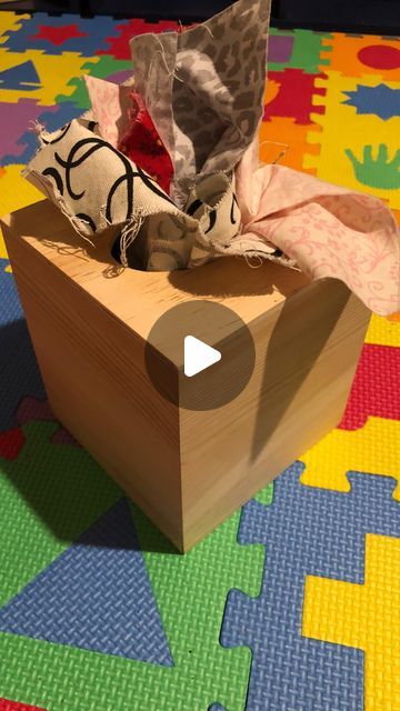 DIY Tissue Box Toy - Why pay $30 for a tissue box toy when you can make it yourself for $5?! Create this Montessori inspired infant toy in minutes! Your baby won’t know the difference 😉 and they’ll have a blast! Difficulty level: Easy Materials: Wooden tissue box and fabric scraps and/or fabric quarter Cost: $5-10 Steps: 1. Buy wooden tissue box at your local craft store. I got mine at Michaels for $5. 2. Buy a fabric quarter, you should be able to get these on sale for $1-2 each. Or use any big fabric scraps you have laying around like I did. 3. Cut the fabric into medium sized squares 4. Stuff into box. Doesn’t have to be ironed or folded fancy - they’re going to pull them all out 100 times over anyway. 5. Viola! For a completely upcycled toy you can us Toys For Infants, Kleenex Box, Instagram Diy, Local Crafts, Having A Blast, Tissue Box, Craft Store, Tissue Boxes, Wooden Box