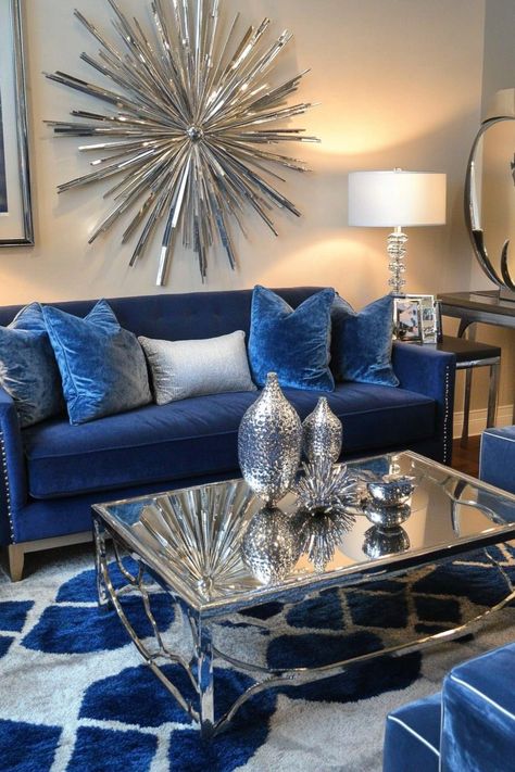 Blue and silver living rooms exude an air of sophistication and tranquility. Explore 26 inspiring ideas that showcase the versatility of this timeless color combination. Discover how to create a space that's both stylish and inviting, using blue and silver accents, furniture, and decor. Find inspiration for transforming your living room into a haven of elegance and comfort. Navy Blue Gray And Gold Living Room Ideas, Blue Accent Living Room Decor, Show The Most Beautiful Silver Glam Living Rooms, Silver And Blue Living Room, Royal Blue And Grey Living Room, Royal Blue Sofa Living Room Ideas, Blue And Silver Living Room Ideas, Blue And Silver Living Room, Royal Blue Living Room Decor