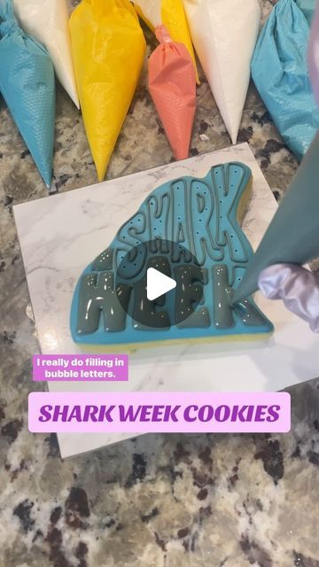 Ashley Marquez on Instagram: "🦈 HOW TO: get puffy icing letters!
• Begin this step when the base icing has crusted but not dried all the way
• poke holes in the base icing (you can see the poke holes) 
• OR use extra thick icing to create “lifts” in the middle of the letters, then fill in with 10 second icing 
• let outlines completely dry (10 minutes) so they really hold their shape 
• fill in with 10 second icing so the icing settles mostly on its own, just needs a little wiggle 
• use the tip of the bag or a scribe to really connect the flood icing to the borders, giving a seamless look
• overfill on wide areas, being careful in tight spots or letters with a hole in the middle - you don’t want the holes to overflow and fill in! 
• dry your icing with a direct fan, immediately. You want Flood Icing, Bubble Letters, Royal Icing, No Way, All The Way, Cookie Recipes, In The Middle, Borders, The Middle