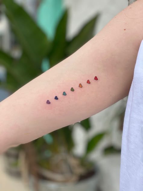 Lgbtqia Tattoo Ideas, Lesbian Symbol Tattoo Ideas, Rainbow Hearts Tattoo, Minimalist Pride Tattoos, Love Is Love Tattoo Pride, Subtle Gay Tattoo, Subtle Pride Tattoo, Bisexual Tattoo Ideas, Pride Tattoo Ideas