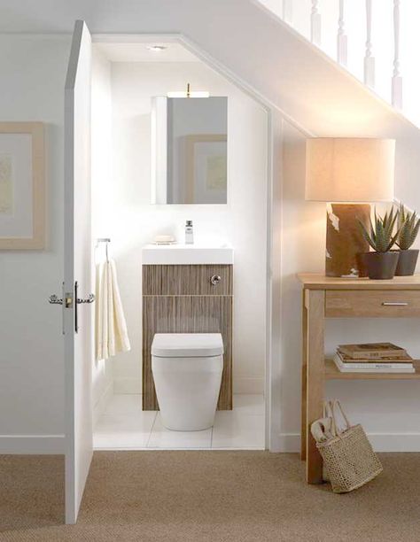 Built-in toilets and bathrooms under staircases | http://www.godownsize.com/toilets-bathroom-built-in-under-staircases/ Interior Design Under Stairs, Understairs Toilet, Design Interior Baie, تحت الدرج, Smart Interior Design, Bathroom Under Stairs, Downstairs Loo, Downstairs Toilet, Stair Case