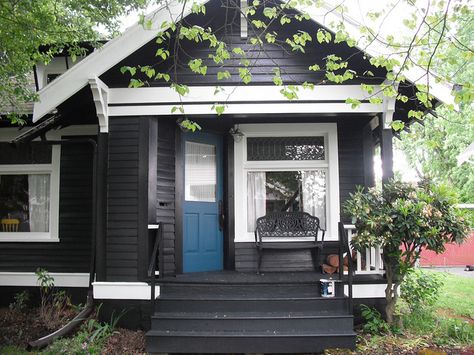 Black with white trim and bright blue door. Unexpectedly beautiful. Black Exteriors, Sea Cottage, Interior Paint Colors For Living Room, Going Dark, Black Cottage, Color House, Black Houses, House Colours, House Trim