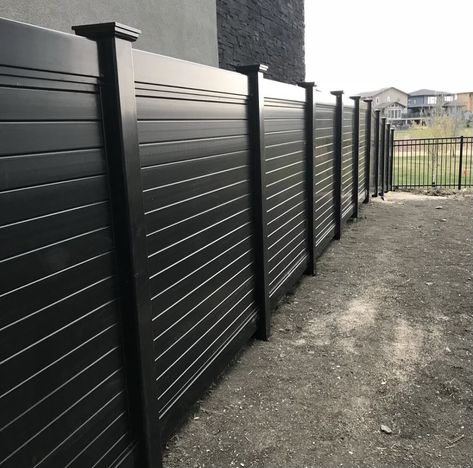 #blackline #commercialfence #vinylfence #commercialfencing #elegantfence #designersofinstagram #blacklinefence #vinylfence #safefence #apartmentfence #local #municipal #municipalfence #fencecontractors #acresofland #fenceforsale #fencedream #landscape #cityfence #fenceimprovement #railing #blackvinyl #vinylrailfence #blackvinylfence #closedpicketfence #fenceinspo #vinylfence #landscapedesign #fencedesign #fencelandscaping Black Semi Private Fence, Fences And Gates Modern Metal, Modern Slat Fence, Black Stained Wood Fence, Black Fencing Ideas, Modern Black Fence, Vinyl Fence Decorating Ideas, Black Fence Ideas, Metal Roofing Fence