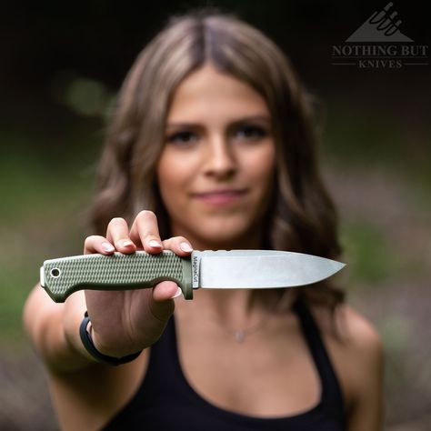 A young woman holding a survival knife in front of here. Tops Knives, Survival Knives, Tough Woman, Finger Guard, Kydex Sheath, Bushcraft Knives, Outdoor Knife, Edc Knife, Wilderness Survival