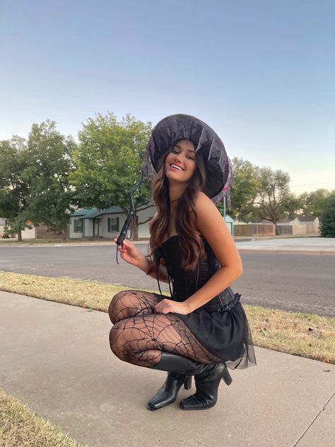 Witch College Halloween Costume, Witch Halloween Costume Corset, Halloween Costumes With Black Knee High Boots, Halloween Costumes Going Out, Aesthetic Witch Halloween Costume, Light Witch Costume, Brunette Woman Halloween Costume, Lily Munster Halloween Costume, Halloween Costume Ideas Witch