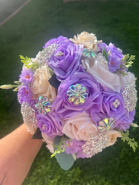 Handmade Quinceañera Bouquet/ Wedding. With Lilac and Ivory Roses. Finished off with Iridescent brooches. *Please note brooches can change in style due to availability.* Decor / color combinations can be changed upon request. {This is a made to order Bouquet}