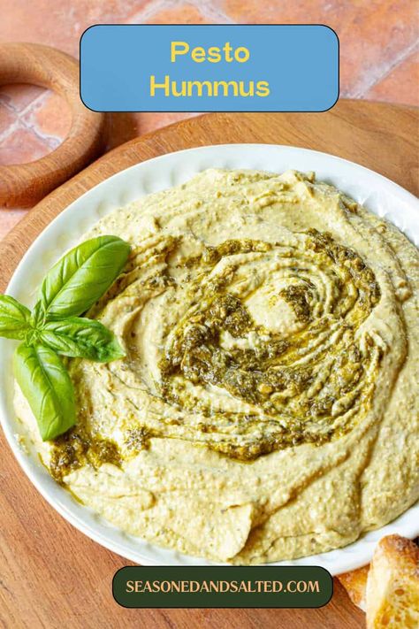 Combine the flavors of pesto and hummus with this irresistible Pesto Hummus recipe. Perfect for parties or snacking, it's a must-try for dip lovers. Pesto Hummus Recipe, Basil Pesto Hummus, Mediterranean Hummus Recipe, Easy Basil Pesto, Pesto Hummus, Hummus Recipe Homemade, Lemon Pesto, Pesto Dip, Garlic Uses