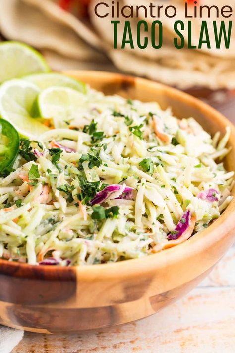 This refreshing Taco Slaw brings a zesty kick to any meal! With Greek yogurt, lime, and jalapeño, it’s a great addition to tacos, burgers, or BBQ. Quick, no-cook, and naturally gluten-free, it’s a simple yet delicious side dish. Jalapeno Cilantro Coleslaw, Bbq Tacos With Slaw, Jalapeno Slaw For Tacos, Coleslaw For Tacos Mexican Slaw, Taco Slaw Dressing, Home Made Coleslaw Dressing Slaw Recipes, Cabbage For Tacos Slaw Recipes, Slaw For Tacos Chicken, Slaw For Tacos Beef