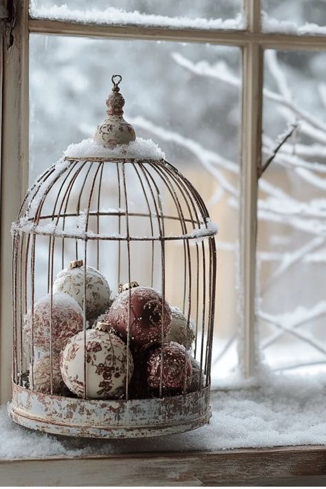 Learn how to make new ornaments look like they've been passed down for generations. Perfect for creating a nostalgic Christmas atmosphere! Some of the links in my articles are affiliate links. If you make a qualified purchase from one of my links I will make a small commission at no cost to you. Thank you for your support!!! Wire Cloche Decor Ideas, Repurposed Bird Cage Ideas, Vintage Bird Cage Decor, Christmas Cloche, Birdcage Decor, Tree Decorating Tips, Cloche Decor, Christmas Styling, Christmas Village Sets