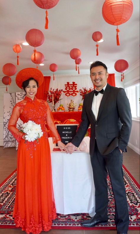 Vietnamese tea ceremony wedding. Bride is wearing the traditional red ao dai while groom is in a more modern black suit and bow tie. Red Tea Ceremony Decor, Vietnamese Wedding Ceremony, Tea Ceremony Wedding Vietnamese Decor, Vietnamese Tea Ceremony Dress, Viet Tea Ceremony, Vietnamese Engagement Ceremony, Yea Ceremony, Tea Ceremony Wedding Vietnamese, Vietnamese Tea Ceremony Decorations