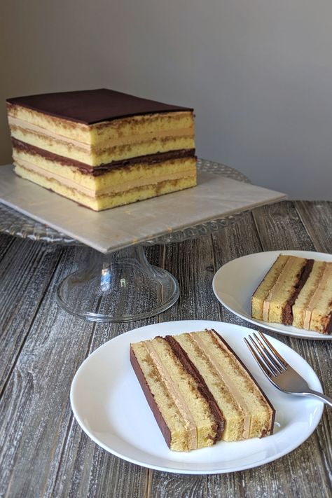 I created this Mini Opera Cake recipe because, let's face it, a full sized dessert is just too dang big.  Layer coffee soaked joconde with coffee buttercream and chocolate ganache for the perfect bite of cake.  This classic French dessert is notoriously complicated, so I've broken it down across several days for you!  #bakesandblunders #foodblogger #foodphotography #cake Cakes For Coffee Shops, Slice Cakes Ideas, Moose Dessert, Opera Cake Recipe, Coffee Frosting, Easy Bakes, Chocolate Layer Cake Recipe, Classic French Desserts, Opera Cake