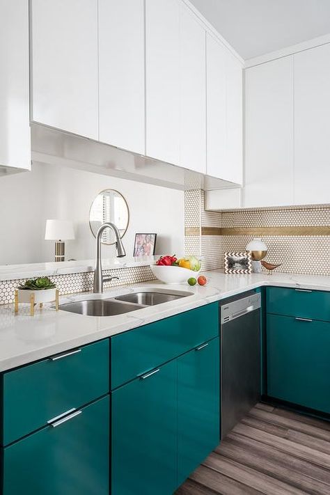 Blue flat front lacquered kitchen cabinets are fitted with a dishwasher located beneath a calcutta quartz countertop holding a stainless steel dual sink with a polished nickel gooseneck faucet beneath glossy white upper cabinets fixed over a pass through. Kichen Cabinate Design, Calcutta Quartz, Casita Kitchen, Glossy Kitchen, Small White Kitchens, Kitchen Cabinet Inspiration, Teal Kitchen, Kitchen Interiors, Kitchen Backsplashes