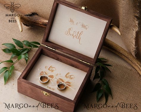 Are you searching for the perfect wedding ring box to add a special touch to your ceremony? Look no further! Our custom engraved wedding ring box is the ideal choice for couples looking to add a personal and unique element to their big day. Crafted with love and attention to detail, our personalised rustic ring box is made from high-quality wood, giving it a timeless and elegant feel. Each box is meticulously engraved with the couple's names and wedding date, making it a cherished keepsake for y Luxury Ring Box, Ring Bearer Box Rustic, Wood Ring Box Wedding, Ring Box Wedding Rustic, Wooden Ring Box Wedding, Engraved Ring Box, Rustic Glam Wedding, Wedding Ring Bearer Boxes, Custom Wedding Ring