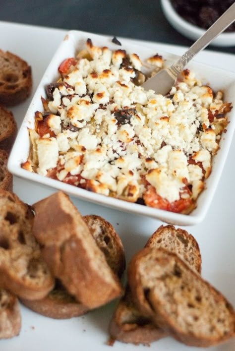 baked Mediterranean Feta dip. oh so easy and so good! Tomato And Feta Dip, Baked Feta Dip, Mediterranean Tomato, Mediterranean Dip, Tomato And Feta, Cookie And Kate, Baked Feta, Feta Dip, Dipped Cookies