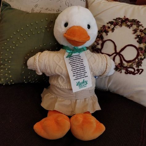 Build a bear lucky ducky wearing a cream knitted sweater and a tan cargo skirt, sitting on a couch with coquette style cushions Lucky Ducky, Build A Bear Outfits, Lucky Duck, Bear Outfits, Cute Stuffed Animals, Build A Bear, Cute Toys, Safe Space, A Name