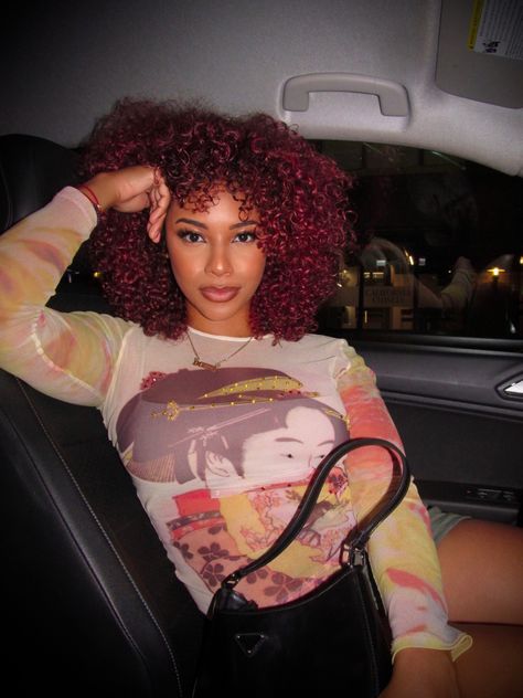 Red curly hair light skin girl in drive seat car posing Cherry Red Curly Hair Black Women, Red Hair Mixed Girl, Red Curly Hair With Bangs, Dark Red Natural Hair, Red Curly Hair Black Women, Bright Red Curly Hair, Cherry Red Curly Hair, Afro Hair Red, Red Curly Hairstyles