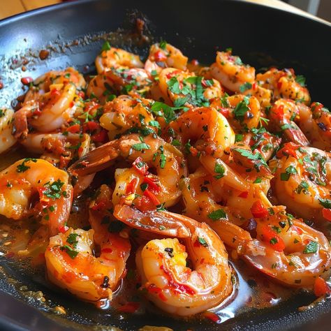 Garlic Prawns Gambas al Ajillo Sizzling Garlic Shrimp to Spice Up Your Meal! 🍤 Hashtag: #GambasAlAjillo #GarlicShrimp #SpanishTapas Ingredients: 500 g shrimp, peeled and deveined 6 cloves of garlic, thinly sliced 100 ml olive oil 1 tsp red pepper flakes Fresh parsley, chopped Salt to taste Instructions: Heat the olive oil in a large skillet over medium heat. Add the garlic and red pepper flakes, and sauté until fragrant. Add the shrimp and cook until they turn pink, about 3-4 minutes. Spri... Chilli Garlic Shrimp, Continental Cuisine, Prawn Stir Fry, Garlic Prawns, Spanish Tapas, Shrimp Recipes Easy, Steak House, Garlic Shrimp, Indian Snack Recipes