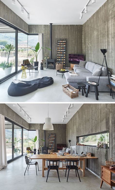 Inside this modern house, exposed concrete walls are softened by the use of comfortable couches, plants, and artwork. #ModernLivingRoom #ModernInteriorDesign Concrete And Glass House, Plantshop Display, Exposed Concrete Wall, Exposed Concrete Interior, Concrete Walls Interior, Concrete Living Room, New Modern House, Concrete Interiors, Concrete Houses