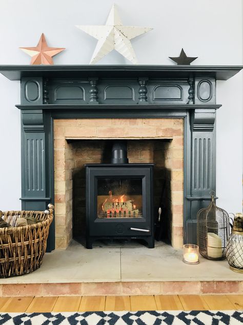 Dark grey fire surround in Farrow & Ball Downpipe with wood burner Fire Surround Ideas, Woodburner Surround, Fire Places Ideas Living Room, Fire Places Ideas, Farrow Ball Downpipe, Fireplace Surround Diy, Wood Fireplace Surround, St Cyprian, Fireplace Hearth Tiles