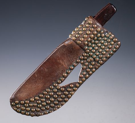 Blackfoot Tacked Knife Sheath with Knife. Brass tacks on commercial leather, triangular belt opening. Circa 1880's. 10" long by 4" wide. Knife is a J. Russell & Co. Green River Works, 12" overall with wood slab handles. Blackfoot Indian, Native American Regalia, Plains Indians, Brass Tacks, Indian Artifacts, Native American Crafts, Case Knives, Native American Artifacts, Green River