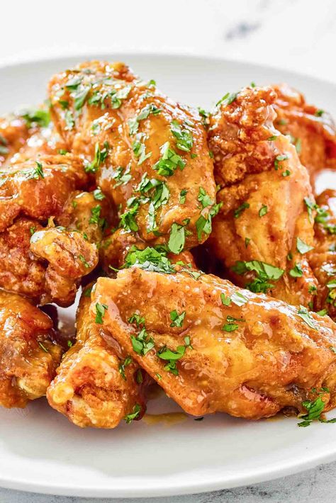 Experience the sweet and spicy sensation of Mango Habanero Chicken Wings. Deep-fried to perfection, these crispy wings are generously tossed in a homemade mango habanero sauce, creating a perfect blend of flavors that will leave you craving for more. Get the easy recipe and find out how to make the best mango habanero wings. Whether it's a game day, movie night, or just craving some finger-licking goodness, these wings will surely hit the spot. Mango Habanero Chicken Wings, Mango Habanero Chicken, Mango Habanero Wings, Habanero Wings, Habanero Chicken, Breaded Wings, Mango Habanero Sauce, Honey Garlic Wings, Smoked Paprika Chicken