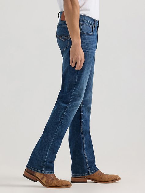 A MODERN TAKE ON A CLASSIC FITWrangler® 20X® vintage bootcut jeans combine the comfort you want with the durability you need to take on each day with confidence. No. 42 jeans from the Wrangler® 20X® collection are finished with distressed detailing for an instant broken-in appeal. They sit just below the waist for a casual look you can wear on any occasion. They also feature a slim seat and thigh as well as a full opening from the knee down to leave room for your boots. The Wrangler® 20X® vintage bootcut jeans are available in a variety of washes. Best of all, each jean comes with bold embroidery on the back pocket to take your look to a whole new level. Wrangler Bootcut Jeans, Vintage Bootcut Jeans, Bootcut Jeans Outfit, Bold Embroidery, Jeans Outfit Men, Mens Bootcut Jeans, Bootcut Jean, Mens Fashion Casual Outfits, Mens Fashion Casual