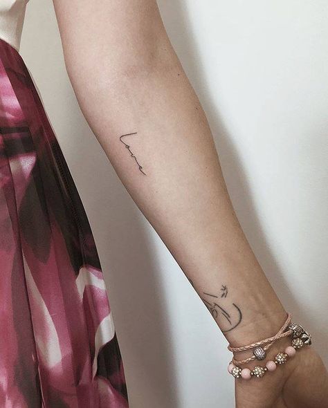 “Love” temporary tattoo on the inner forearm. Inner Arm Script Tattoos For Women, Script Tattoo On Arm, Forearm Script Tattoo, Forearm Word Tattoo, Rib Tattoos Words, Font Tato, Wörter Tattoos, Girl Shoulder Tattoos, Inner Forearm Tattoo