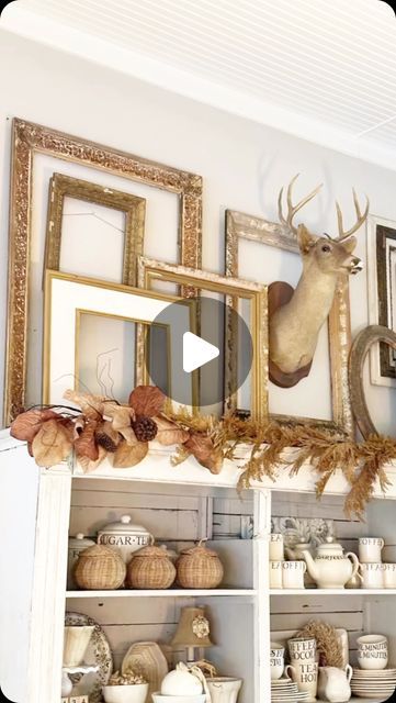 Michele Howell 🏠 Vintage Home Designs on Instagram: "Changing out the decor on top of my kitchen hutch is something I look forward to designing with each season. 

Last year, I bought this deer head at a barn sale and had planned to use it last year at Christmas.

I ended up not getting that done, so I’ve looked forward to incorporating it this fall.

I added a collection of vintage gold frames and a simple fall garland. 

I’m trying to decide if he’s staying for my Christmas display too. 

Note: before anyone gets upset about the deer, I didn’t kill the deer and Mr. VH didn’t kill the deer. 😊

#vintagehomedesigns
#cottagefarmhouse
#farmhousestyle
#fallstyling #falldecorating 
#americanfarmhousestyle
#falldecor #homedecor" Framed Deer Head, Simple Fall Garland, American Farmhouse Style, Kitchen Hutch, Fall Garland, Gold Frames, Cottage Farmhouse, A Barn, Deer Head