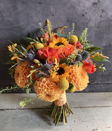 This bouquet contains the best of autumn colours and flowers! Dahlias, sunflowers, seedheads and thistles in vibrant autumn shades. Daisy Fall Bouquet, Colourful Fall Wedding Flowers, Fall Flowers With Sunflowers, Fall Wedding Bouquets With Sunflowers Autumn Flower Arrangements, Bright Autumn Color Palette Wedding, Autumn Dahlia Bouquet, Fall Birthday Flower Arrangements, Autumn Sunflower Bouquet, Fall Flower Arrangements With Sunflowers