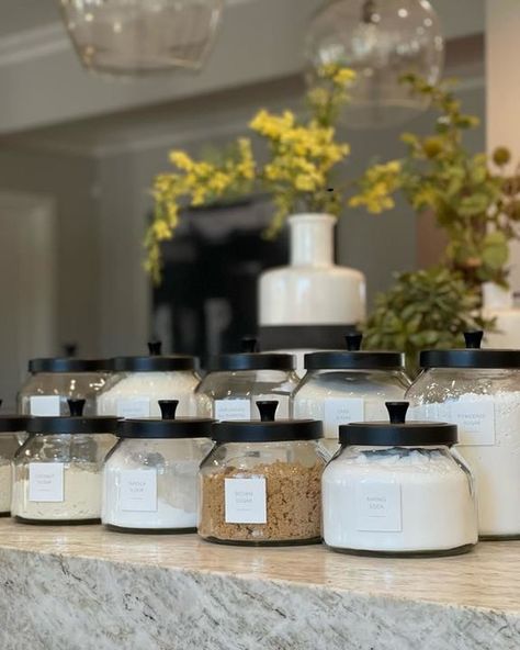 Glass Jars With Black Lids, Glass Canisters In Kitchen Display, Pantry Canisters, Black Kitchen Canisters, Kitchen Open Shelves, White Wood Kitchens, Kitchen Jar, Laundry Kitchen, Glass Jar With Lid