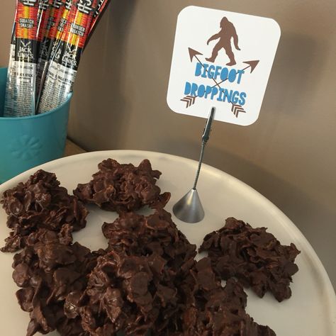 Bigfoot droppings:  melt 1.5 cups chocolate chips with 1 cup peanut butter in microwave.  Fold in 3 cups corn flakes. Drop onto wax paper.  Place in refrigerator until set. Sasquatch Party Ideas, Bigfoot Snacks, Bigfoot Themed Birthday Party, Bigfoot Party Food, Bigfoot Party Ideas, Sasquatch Birthday Party, Bigfoot Birthday Party Ideas, Big Foot Party Ideas, Cryptid Birthday Party