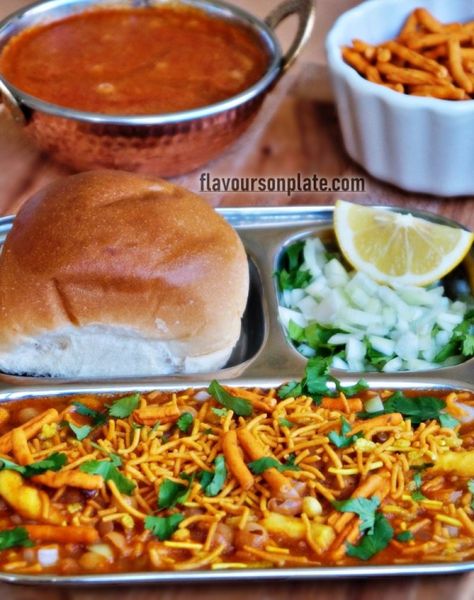 Misal pav recipe | How to make Maharashtrian misal pav recipe   Misal Pav is the most popular street food of Mumbai made up of any sprout curry and topped with farsan. It is the traditional Maharashtrian snack recipe. It is the unique blend of… The post Misal pav recipe | How to make Maharashtrian misal pav recipe appeared first on Flavours on Plate. Misal Pav Recipes, Misal Pav, Spice Chart, Pav Recipe, Dry Coconut, Phoenix Tattoo, Chilli Powder, Garam Masala, Pressure Cooking